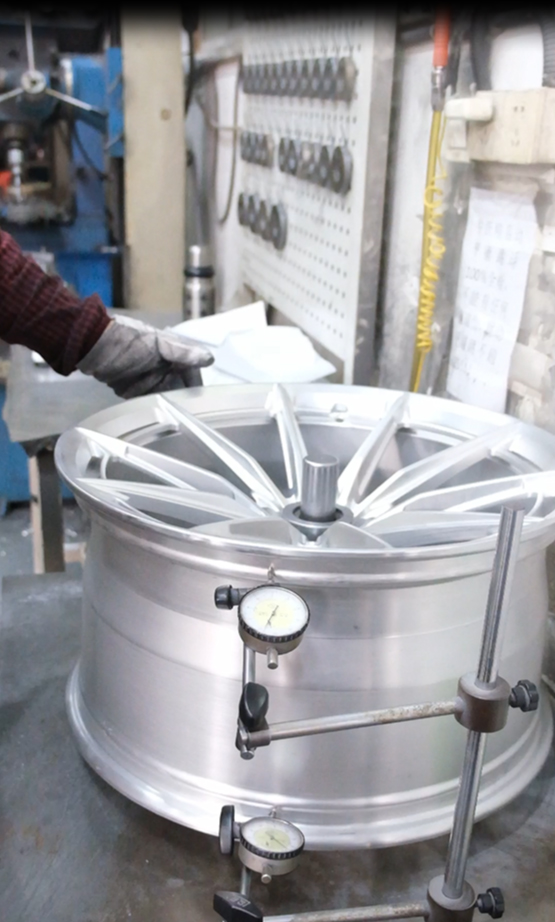 Forged wheel runout inspection with dial indicator